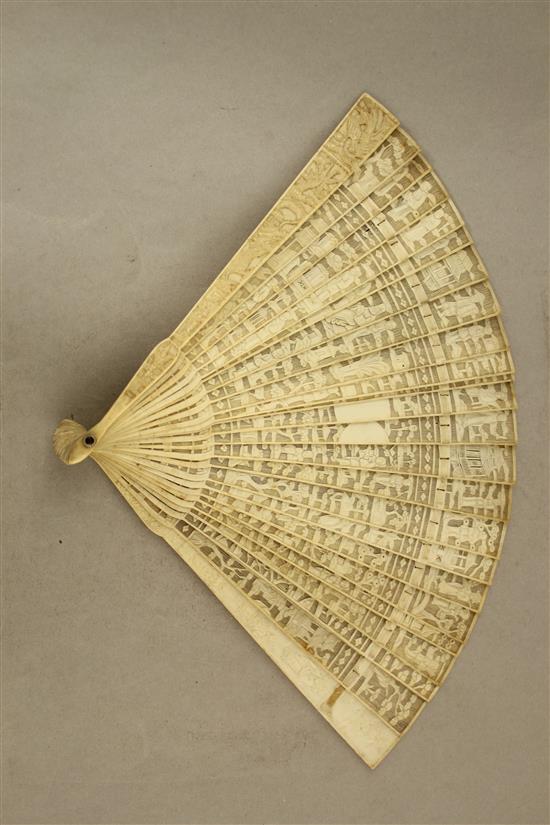 A Chinese export ivory brise fan, c.1900, 20cm.